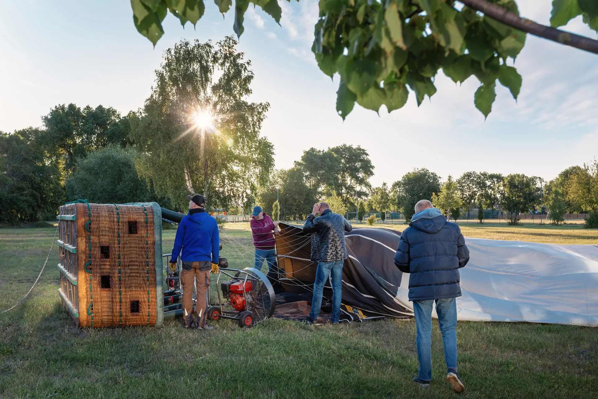 Balloon Crew holding mouth of balloon open for cold inflation